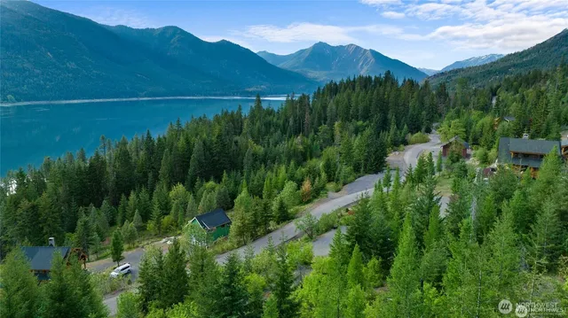 a view of a lush green hillside and a building in the background