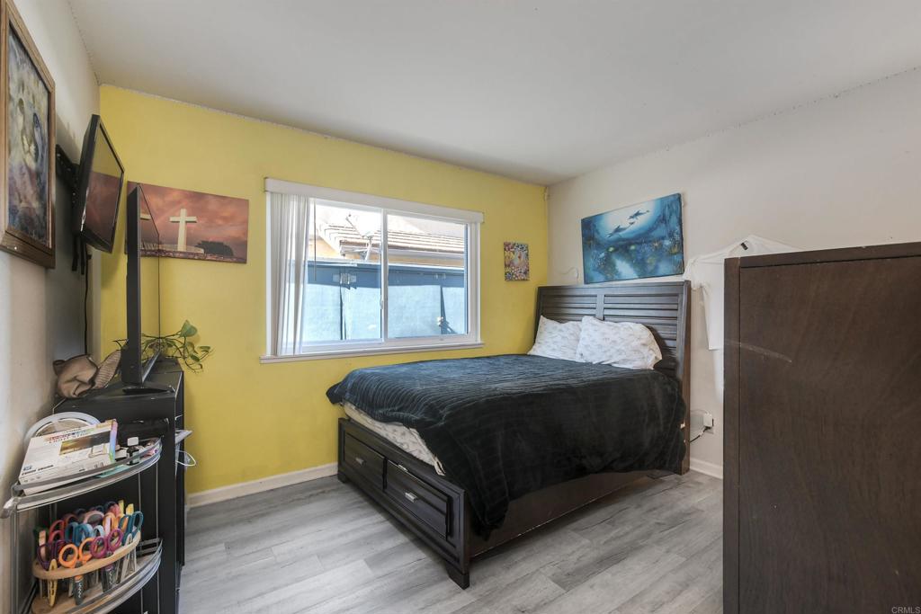 4413 Point Degada Oceanside, CA 92058 - Photo 14 of 31 a bed sitting in a bedroom next to a window