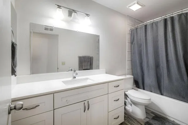 a front view of a house with a yard table and chairs