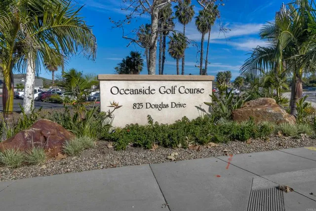 a view of outdoor space with signage and flags