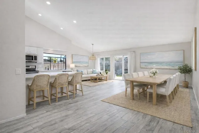 a view of kitchen with wooden floor and large window