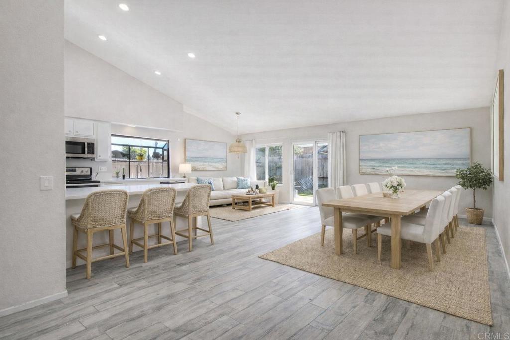 4413 Point Degada Oceanside, CA 92058 - Photo 7 of 31 a view of a dining room with furniture and wooden floor