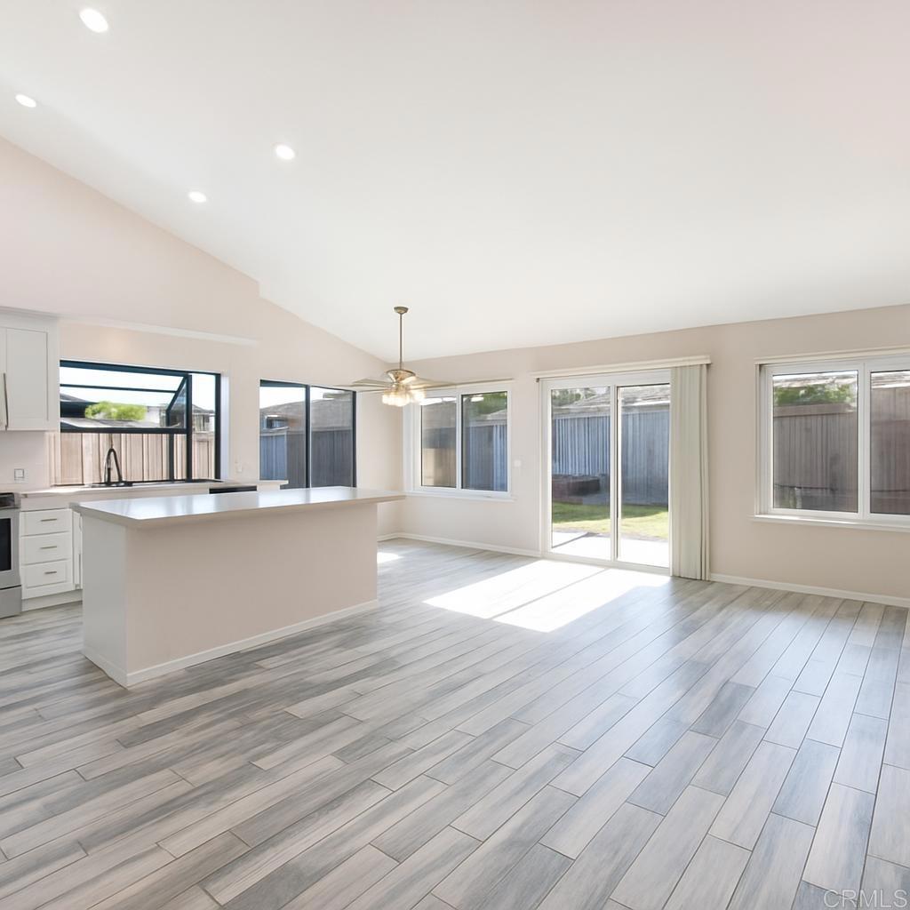 4413 Point Degada Oceanside, CA 92058 - Photo 8 of 31 a view of kitchen with wooden floor and large window