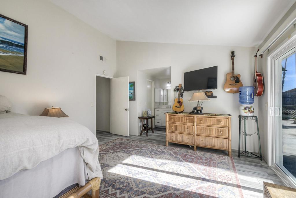 4413 Point Degada Oceanside, CA 92058 - Photo 10 of 31 a bedroom with furniture and a flat screen tv