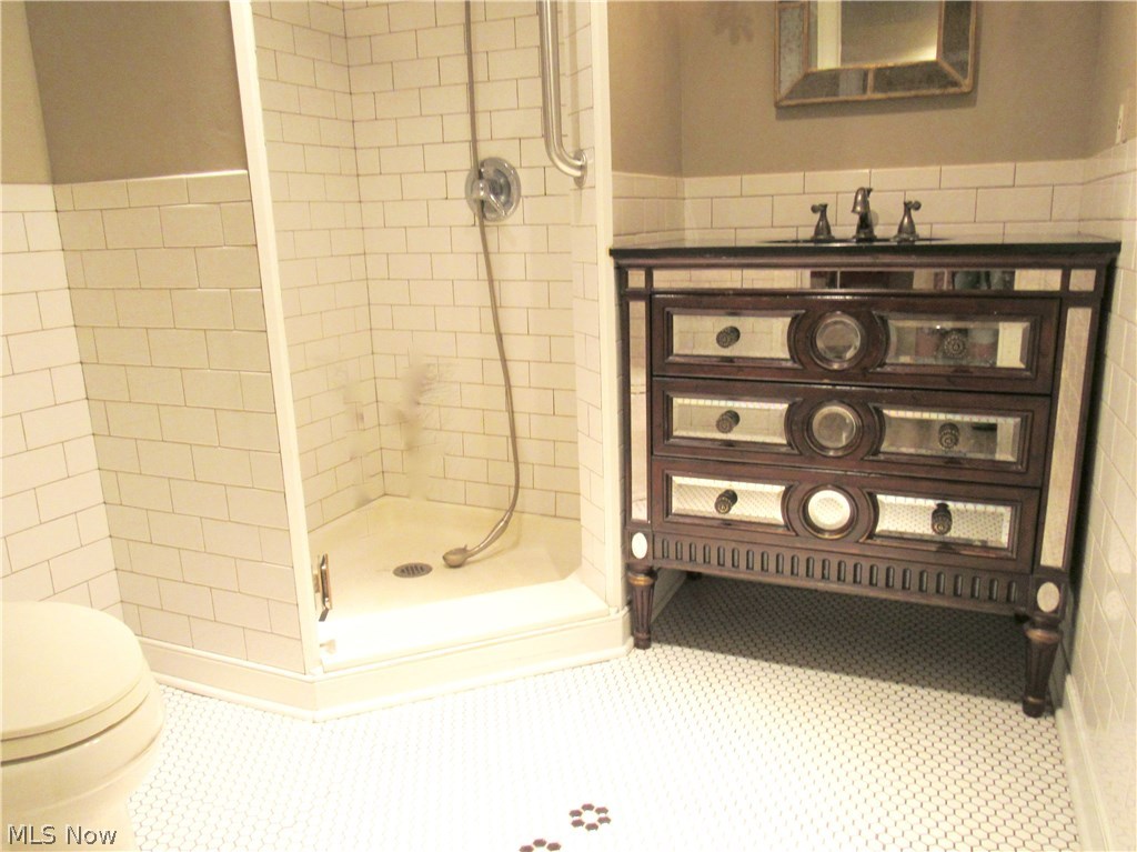 3941 Minor Road Akron, OH 44321 - Photo 26 of 35 Full bathroom in the lower level with subway tile walls