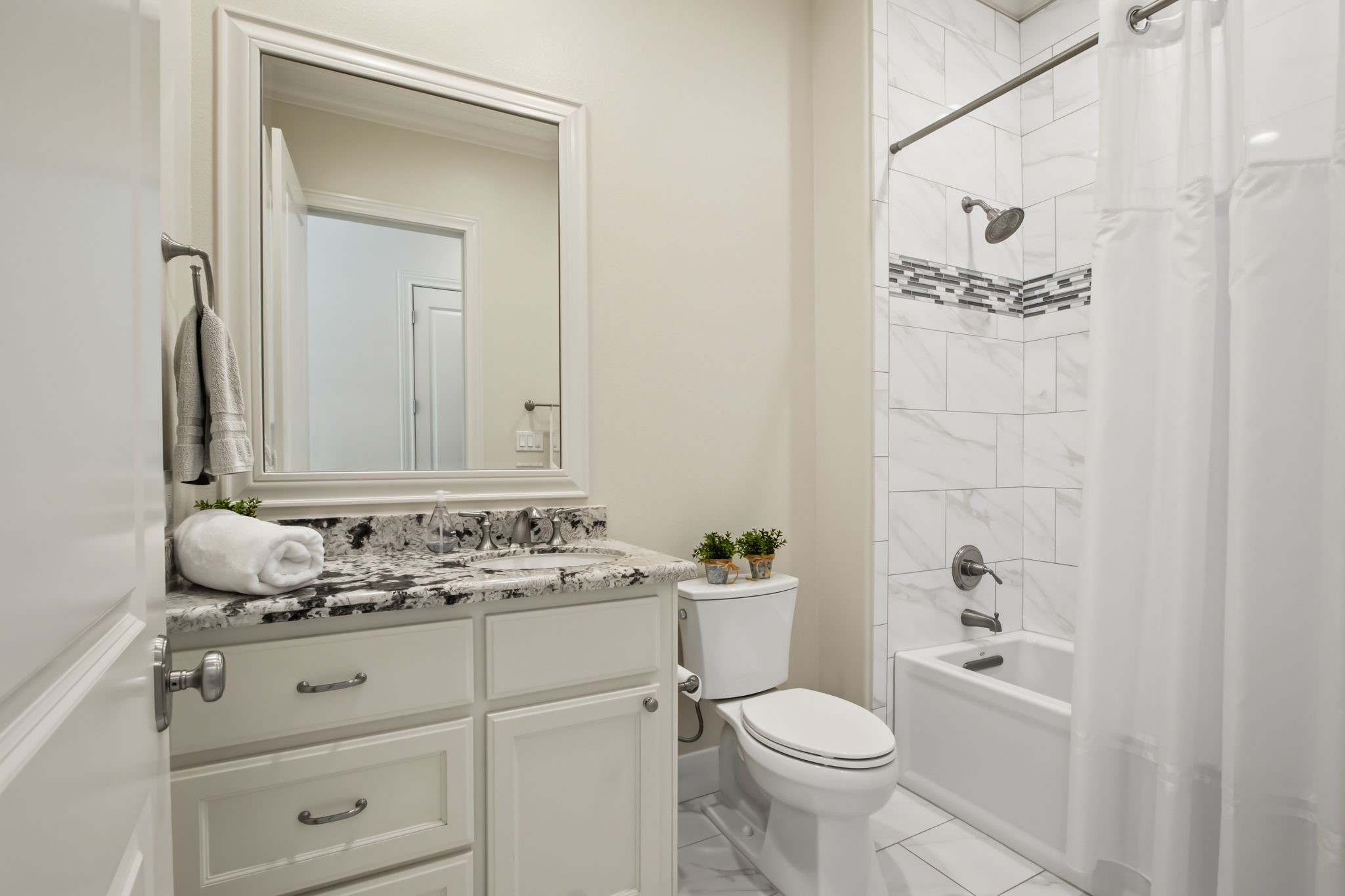 36702 Deer Valley Magnolia, TX 77355 - Photo 19 of 46 a bathroom with a sink a toilet and a mirror