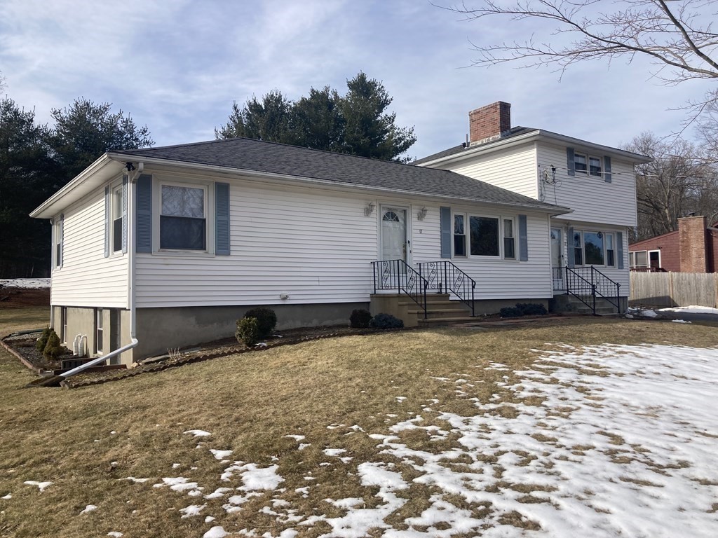 17 Adams Road Grafton, MA 01519 - Photo 11 of 42 a front view of house with yard