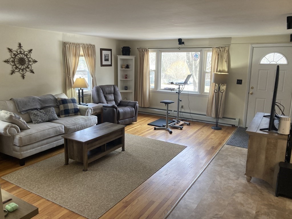17 Adams Road Grafton, MA 01519 - Photo 17 of 42 a living room with furniture and a flat screen tv
