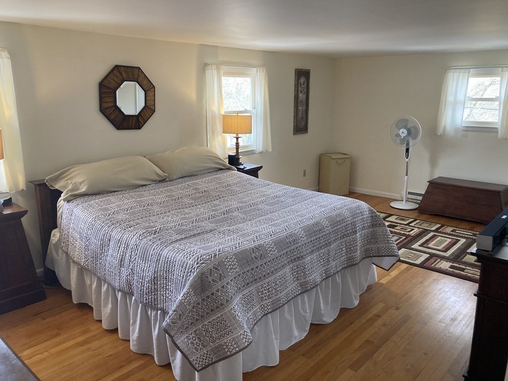 17 Adams Road Grafton, MA 01519 - Photo 21 of 42 a bedroom with a bed and a window