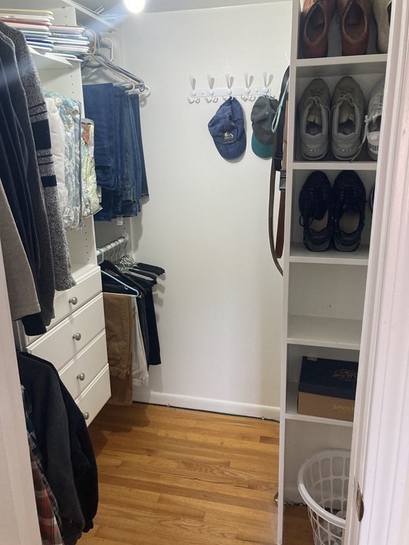 17 Adams Road Grafton, MA 01519 - Photo 23 of 42 a view of walk in closet with clothes and shoes