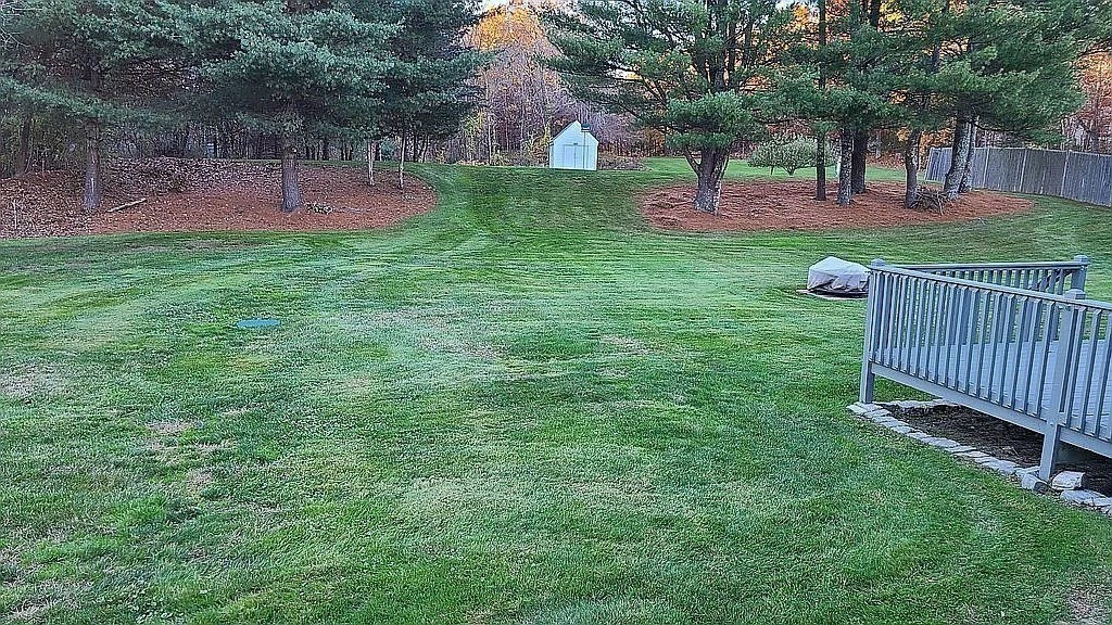 17 Adams Road Grafton, MA 01519 - Photo 3 of 42 a view of a garden with a bench