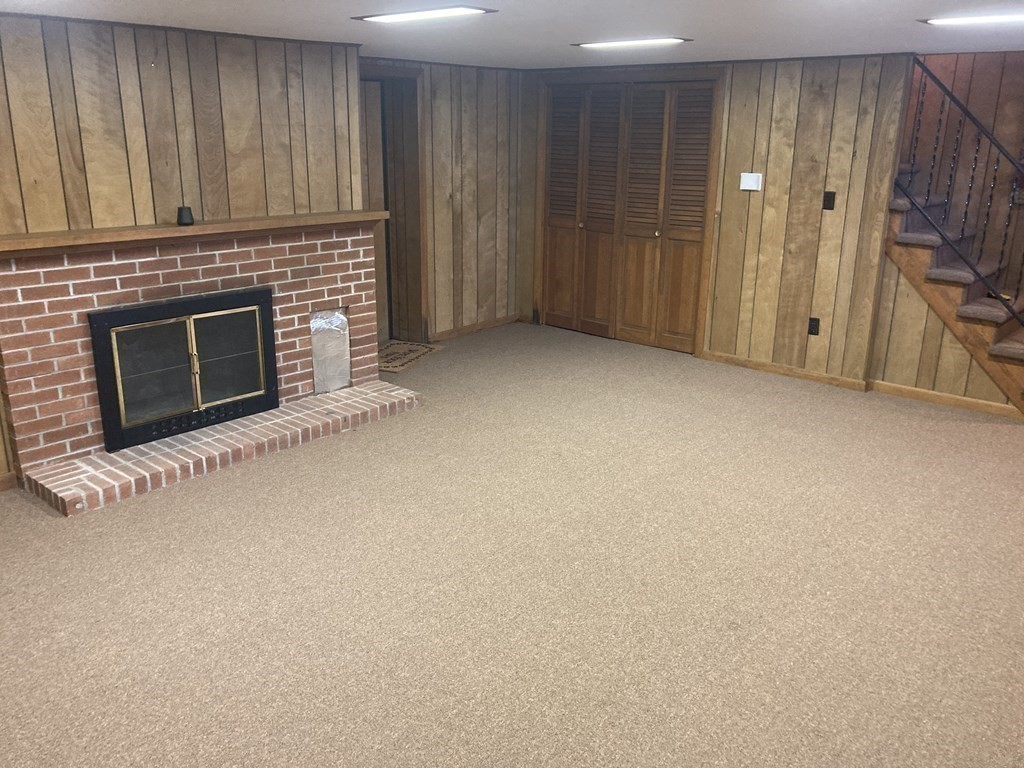 17 Adams Road Grafton, MA 01519 - Photo 33 of 42 a view of an empty room with a fireplace