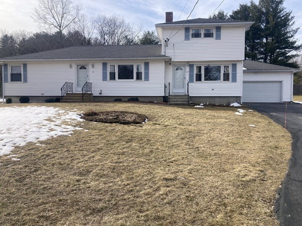 17 Adams Road Grafton, MA 01519 - Photo 6 of 42 a front view of a house with a yard