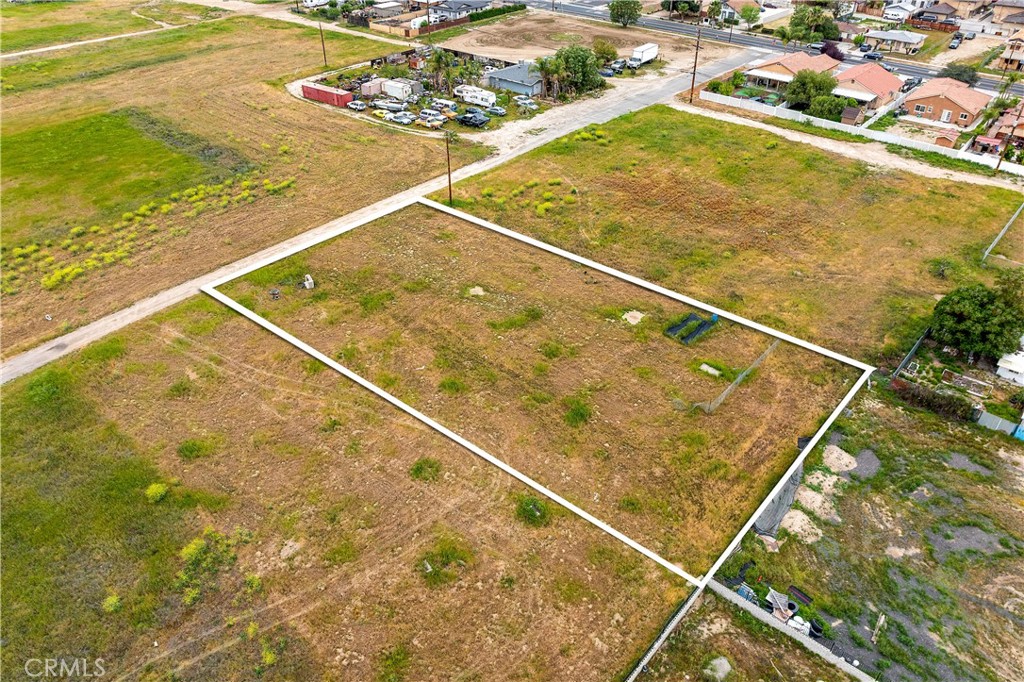 0 South Ramona Drive Perris, CA 92570 - Photo 9 of 13 a blue swimming pool with outdoor seating and yard