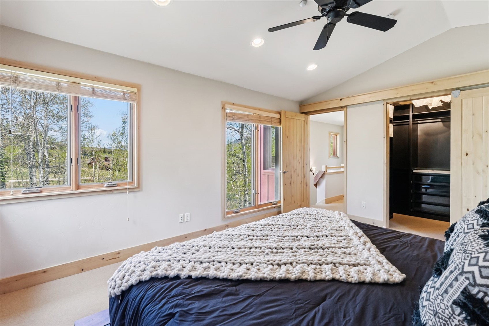 2800 Hunter's Knob Road Silverthorne, CO 80498 - Photo 21 of 37 a bedroom with a large bed and a window