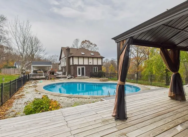 a view of a house with wooden deck