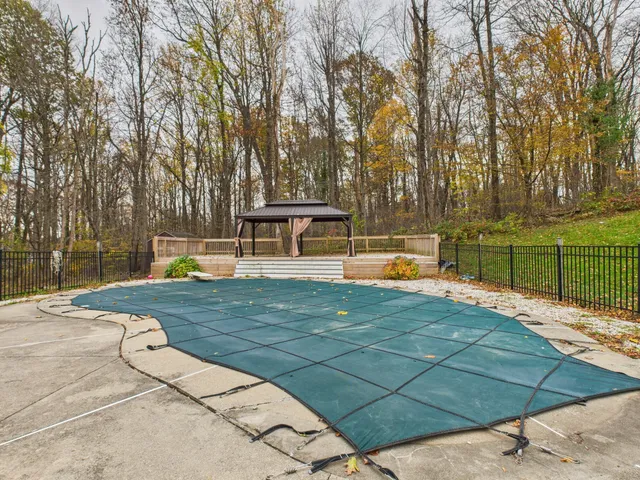 a view of a swimming pool with a patio