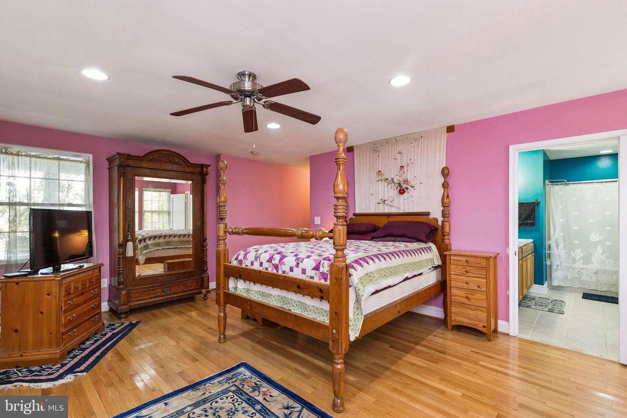 208 Chestnut Street Middleburg, VA 20117 - Photo 12 of 23 a bedroom with a bed and wooden floor