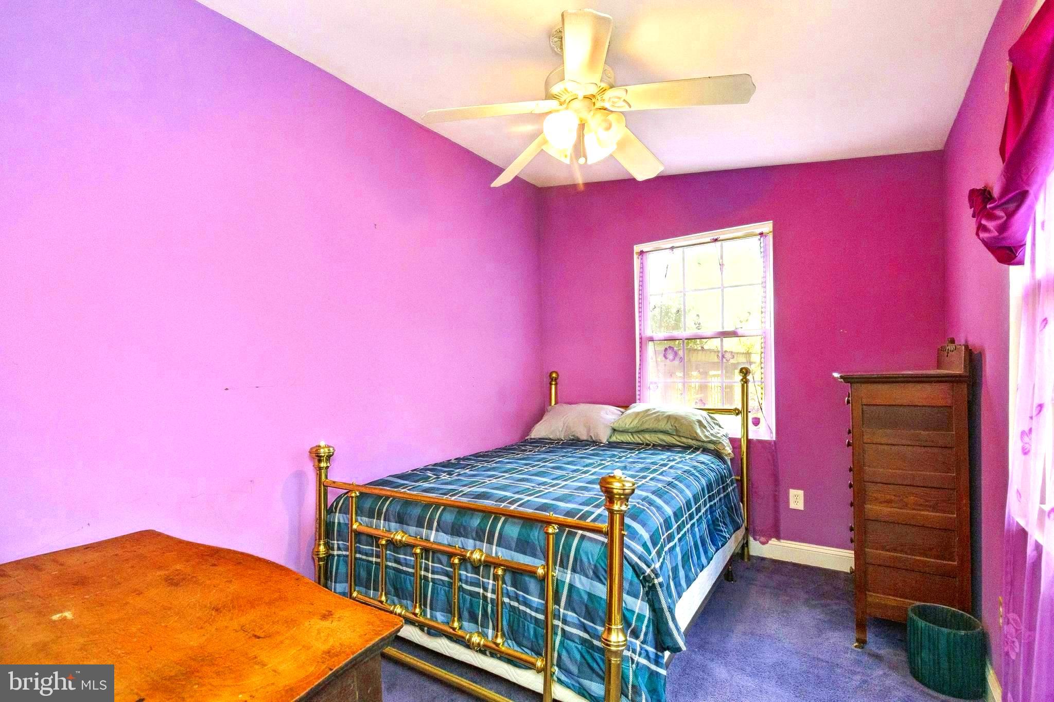 208 Chestnut Street Middleburg, VA 20117 - Photo 17 of 23 a bedroom with a bed and a chandelier