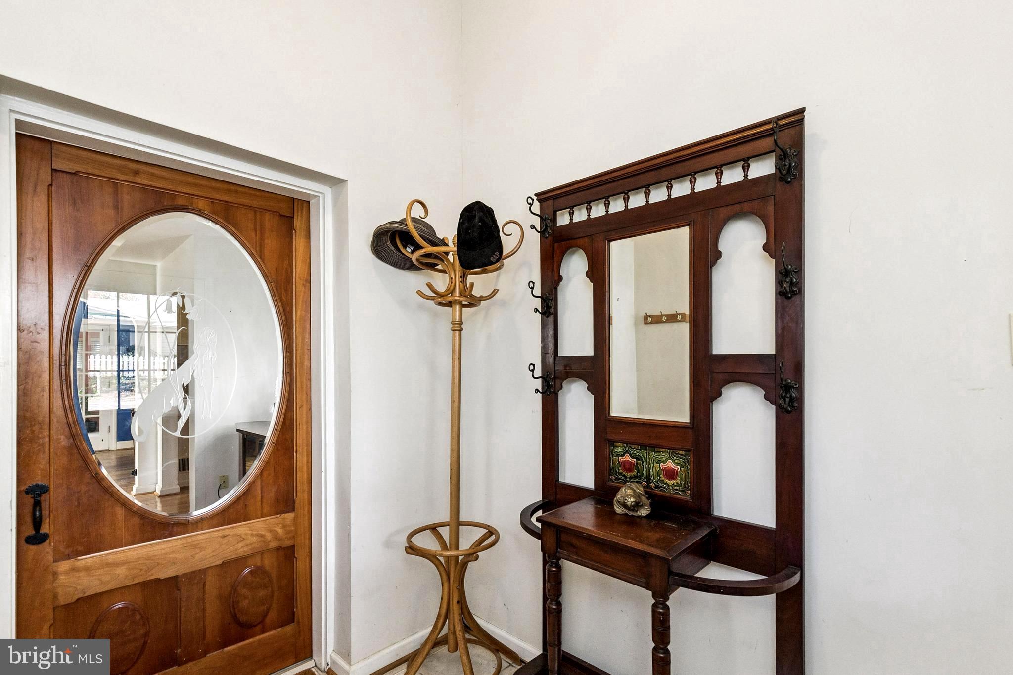 208 Chestnut Street Middleburg, VA 20117 - Photo 4 of 23 a front view of a house with garden equipment