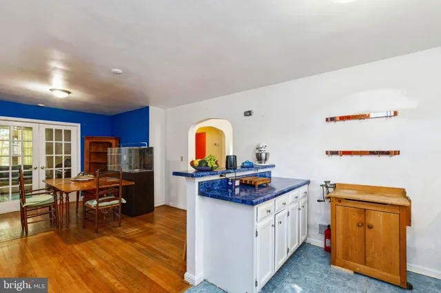 a kitchen with stainless steel appliances granite countertop a stove and a refrigerator