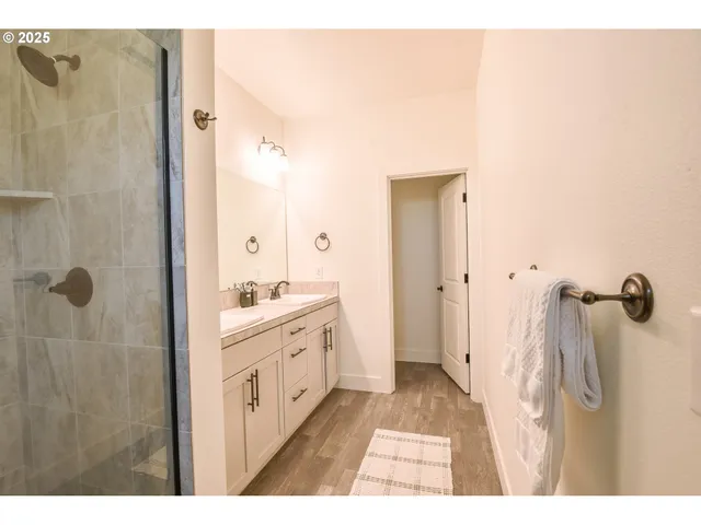 a bathroom with a tub sink and shower