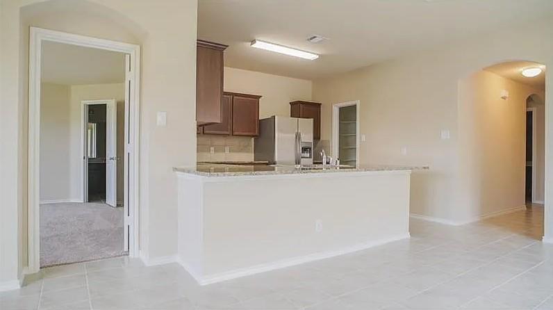 916 Opal Path Princeton, TX 75407 - Photo 3 of 9 a view of kitchen with refrigerator and window