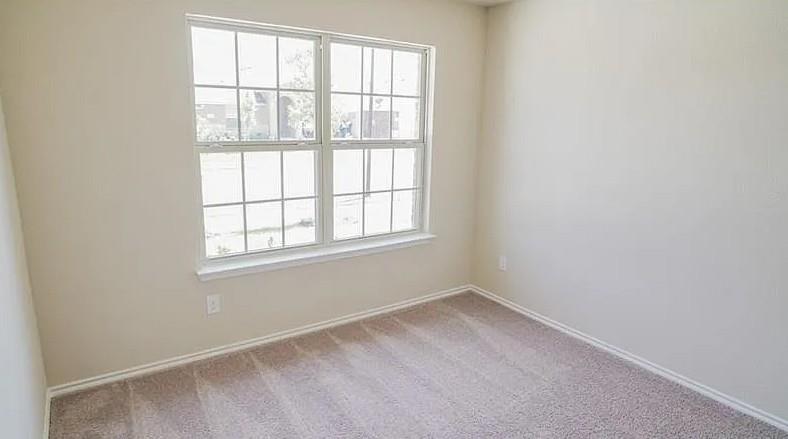 916 Opal Path Princeton, TX 75407 - Photo 8 of 9 an empty room with a window