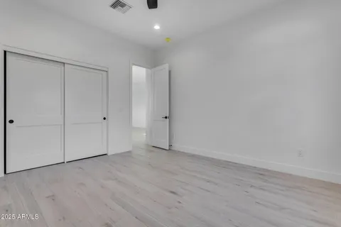 a bathroom with a sink toilet vanity and shower