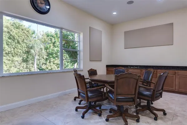 a view of a dining room with furniture and a window