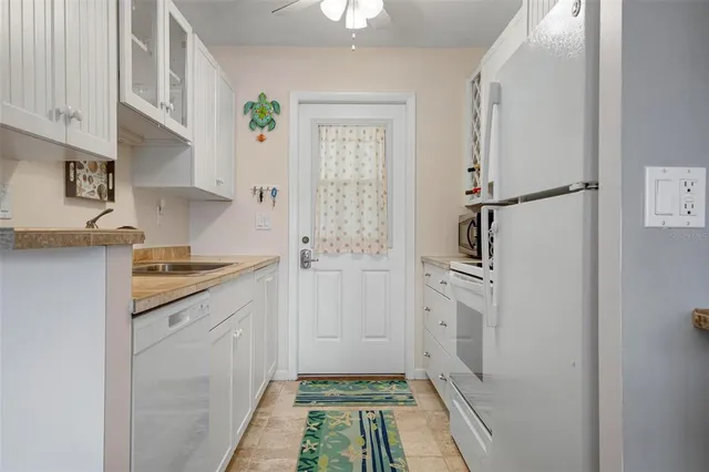 a kitchen with cabinets and a stove