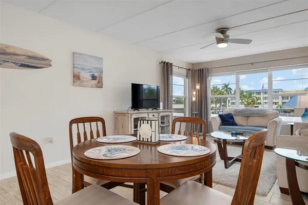 a view of a dining room with furniture window and outside view