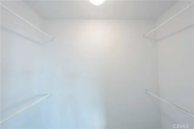 a view of a kitchen with a sink and cabinets