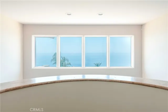 an aerial view of a house with a swimming pool