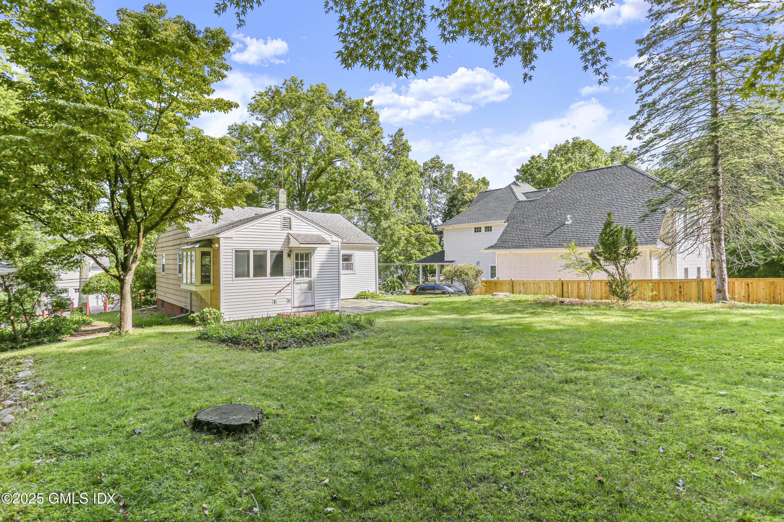 25 Circle Drive Greenwich, CT 06830 - Photo 3 of 7 a view of a house with a yard