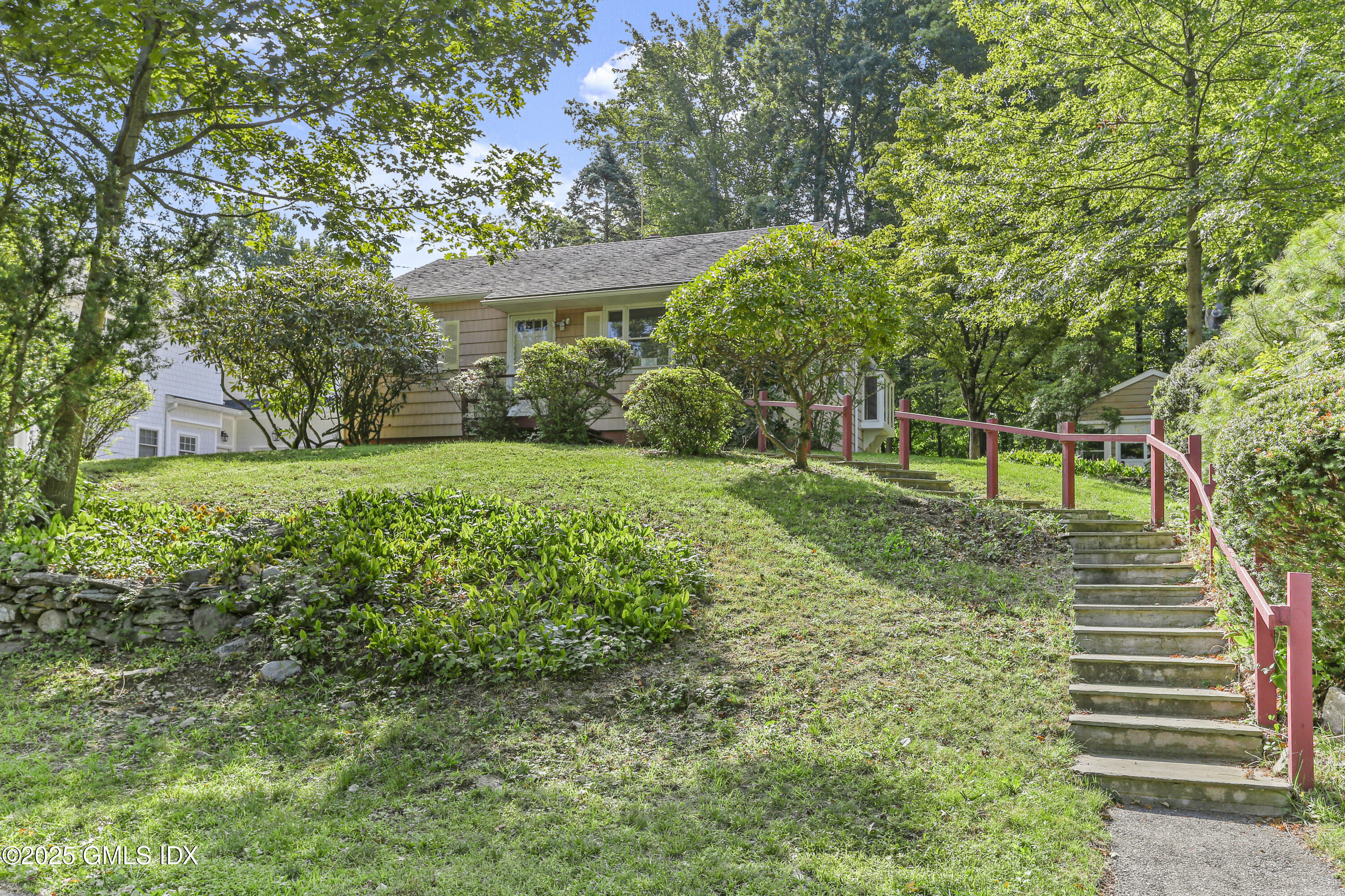 25 Circle Drive Greenwich, CT 06830 - Photo 6 of 7 a view of a house with a yard