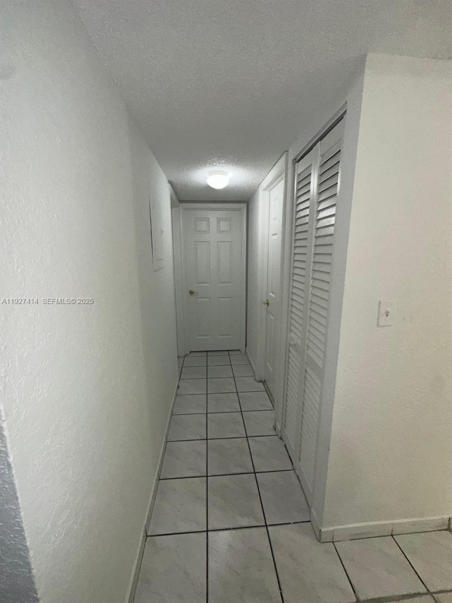 5665 West 20th Avenue, Unit 308 Hialeah, FL 33012 - Photo 7 of 17 a view of a room with white door