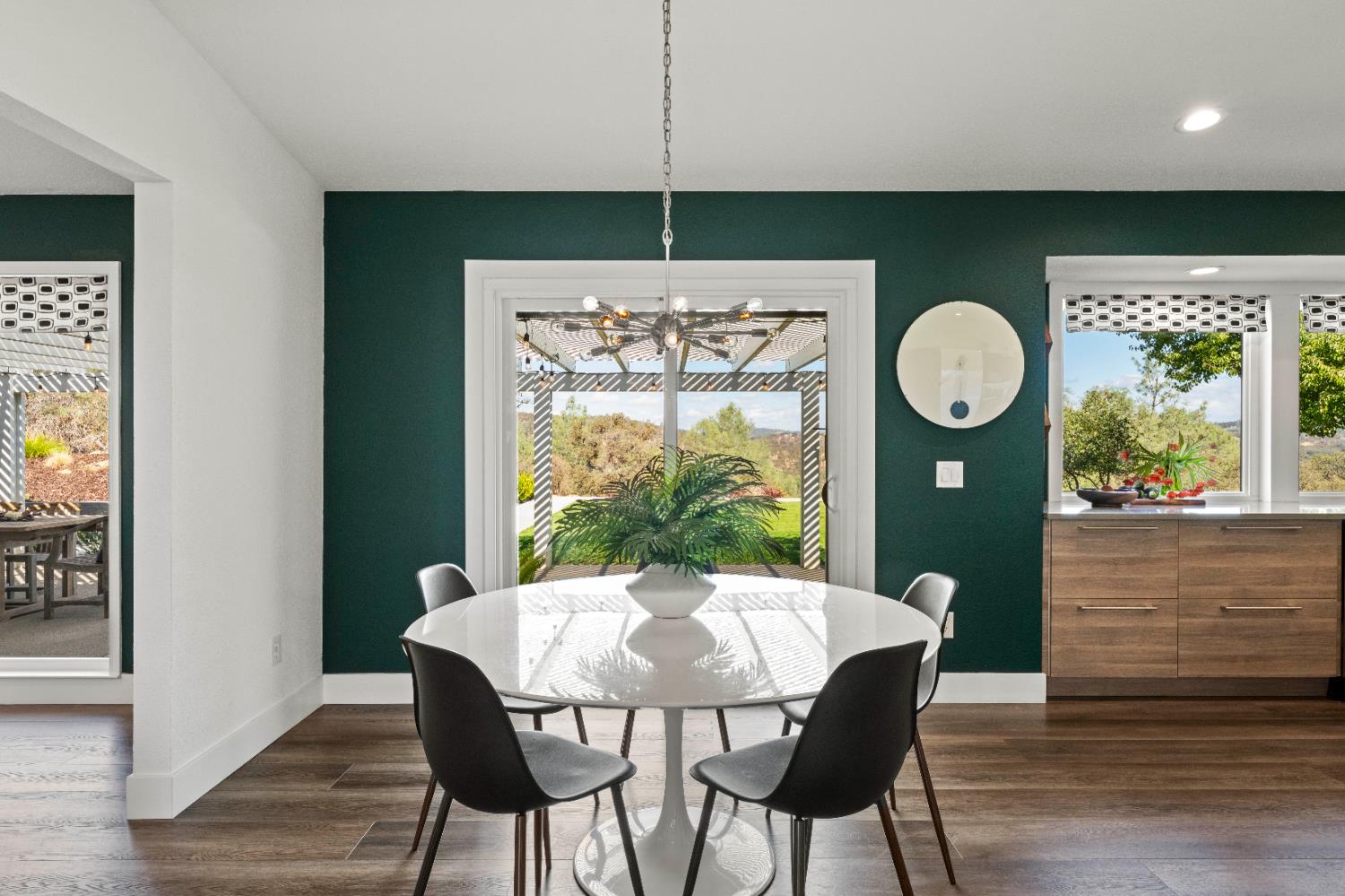 8155 Hubbard Road Auburn, CA 95602 - Photo 15 of 74 a view of a dining room with furniture window and wooden floor