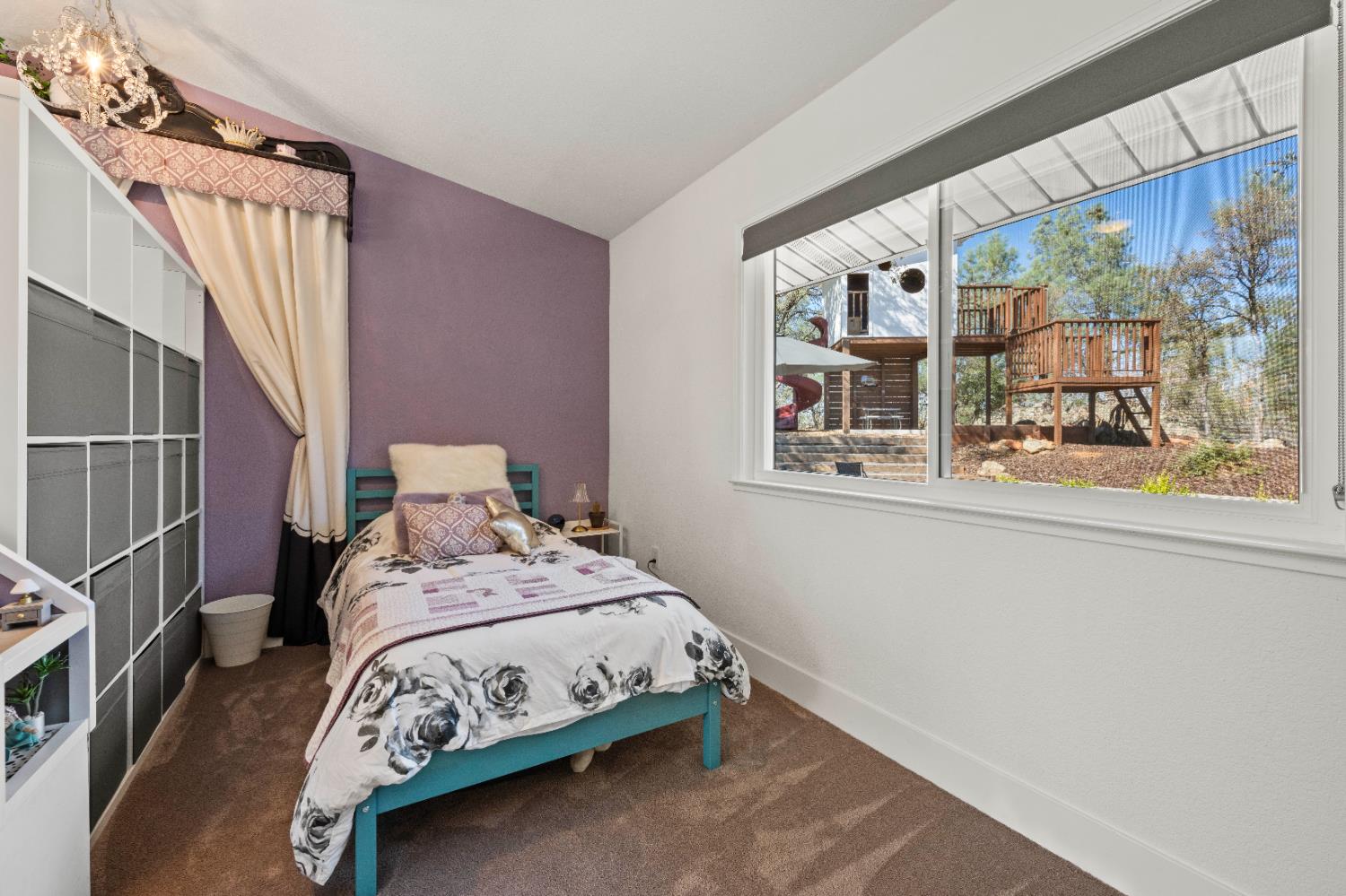 8155 Hubbard Road Auburn, CA 95602 - Photo 27 of 74 a bedroom with a bed and glass window
