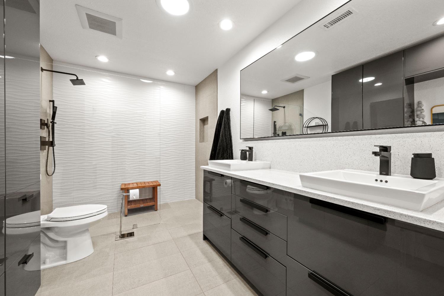 8155 Hubbard Road Auburn, CA 95602 - Photo 35 of 74 a bathroom with a double vanity sink toilet and a mirror