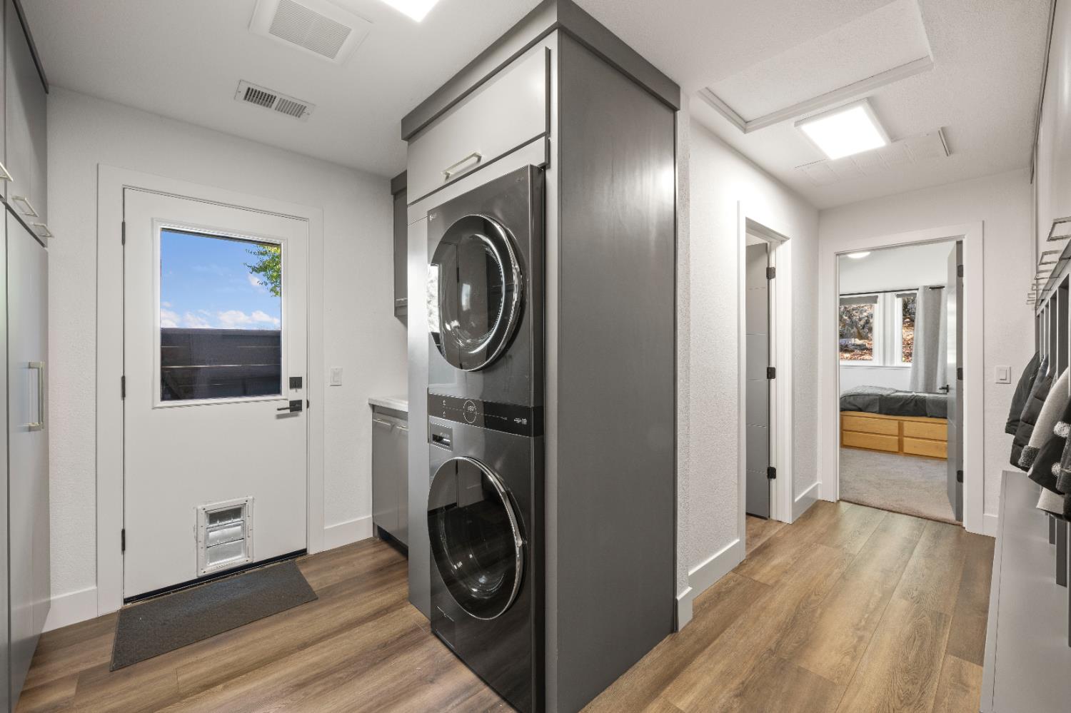 8155 Hubbard Road Auburn, CA 95602 - Photo 38 of 74 a view of a hallway with washer and dryer