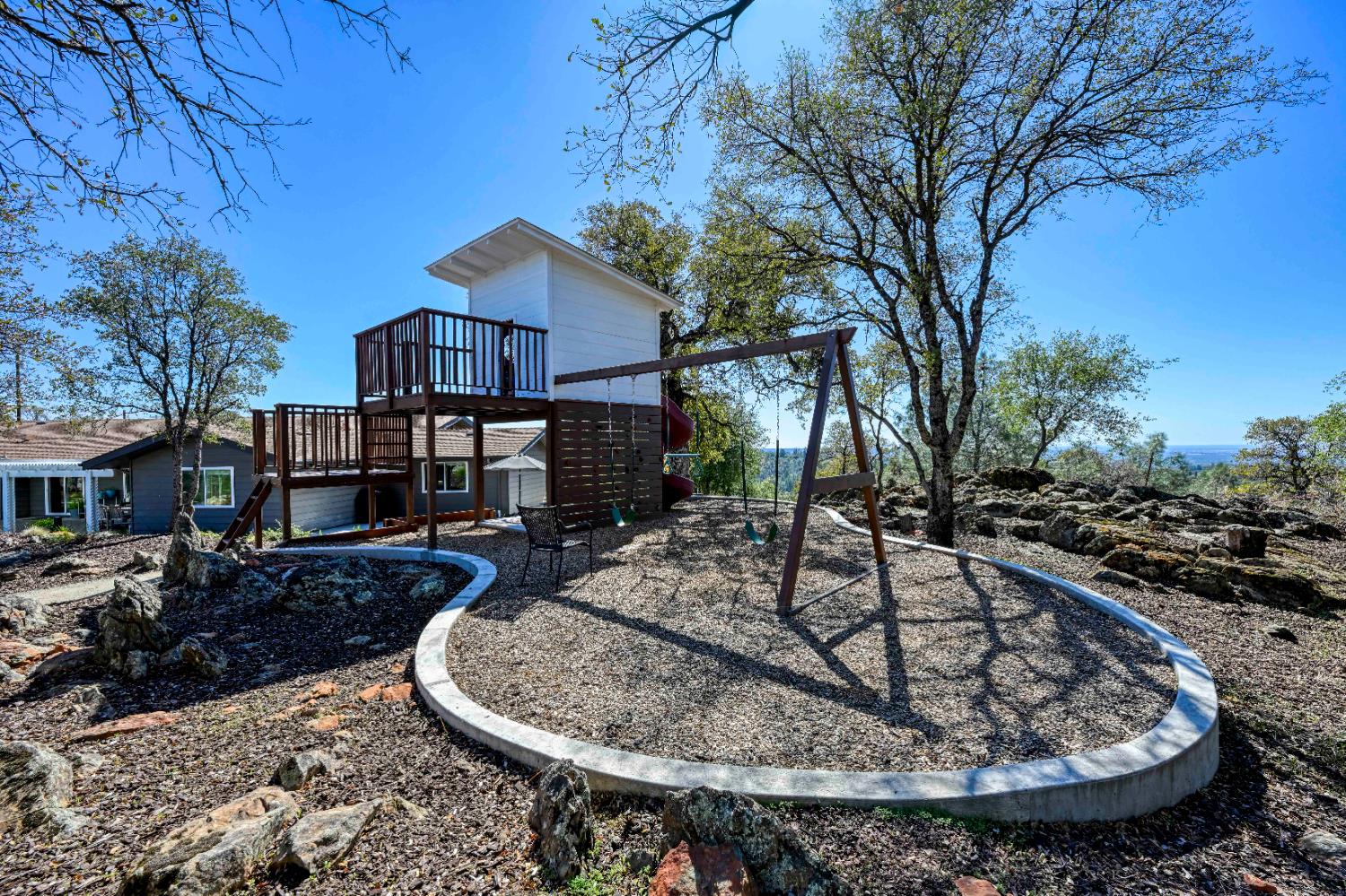 8155 Hubbard Road Auburn, CA 95602 - Photo 54 of 74 a view of a house with a yard fire pit and outdoor space