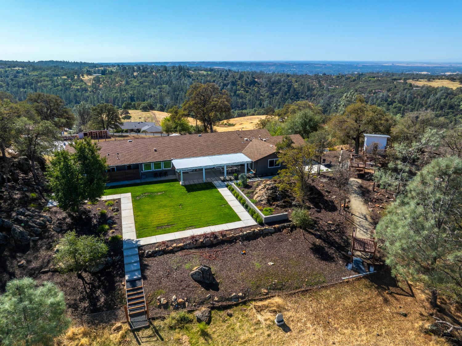 8155 Hubbard Road Auburn, CA 95602 - Photo 62 of 74 an aerial view of a house with a garden
