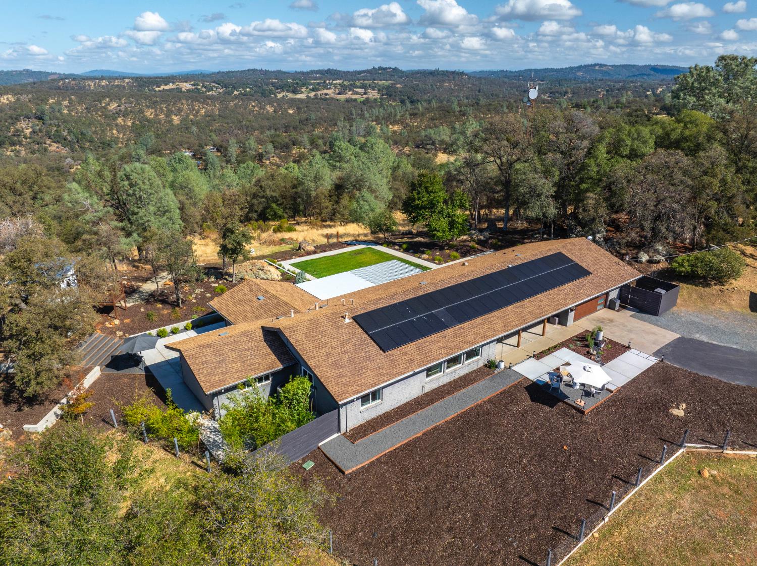 8155 Hubbard Road Auburn, CA 95602 - Photo 73 of 74 an aerial view of a house with a garden