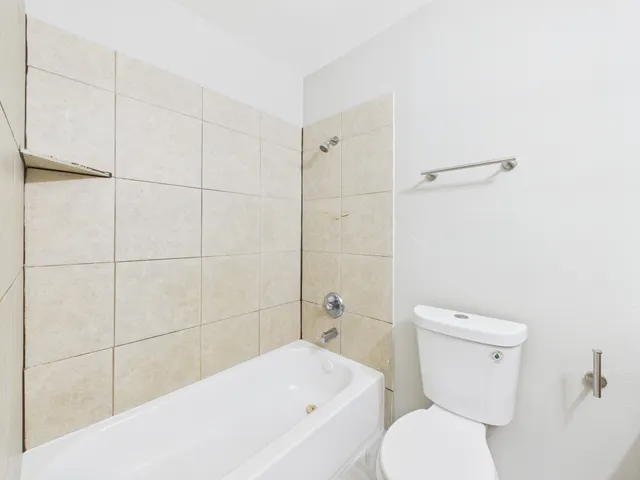 a bathroom with a sink toilet and vanity