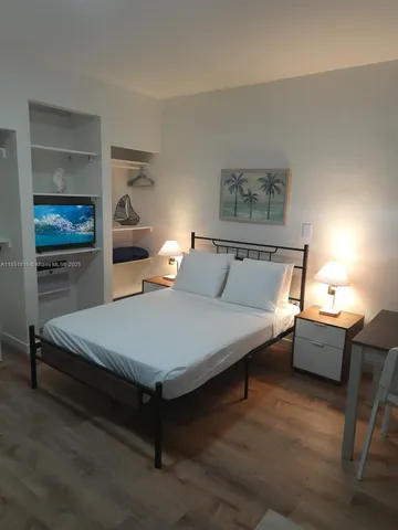 a spacious bedroom with a bed and window