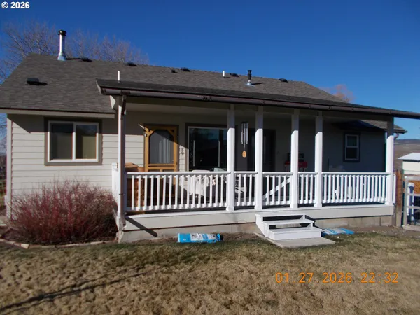 a view of a house with a bench