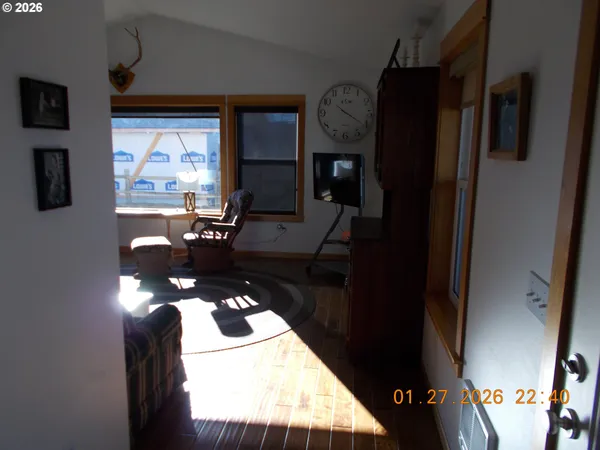 a picture of a living room with a fireplace