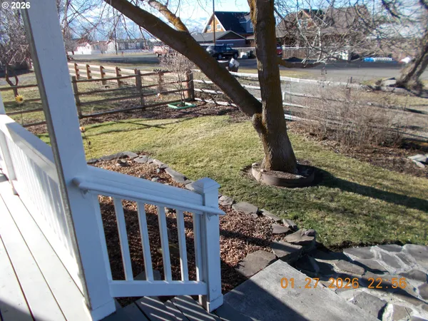 a view of a small yard from a balcony