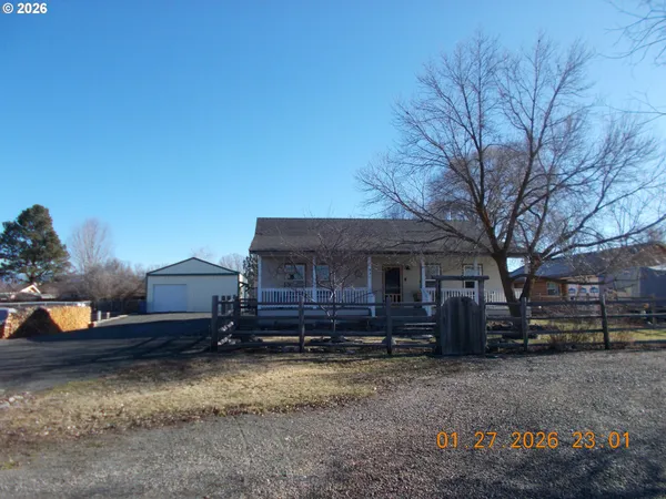 a view of a house with a yard and roof